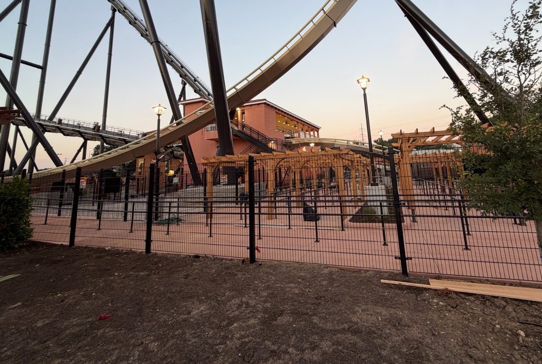 Black Fenceweb welded wire fence panels installed along a new ride area at Six Flags in Dallas, Texas